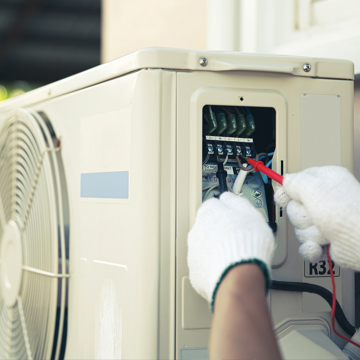 Ricks Affordable Heating & Cooling technician servicing heat pump