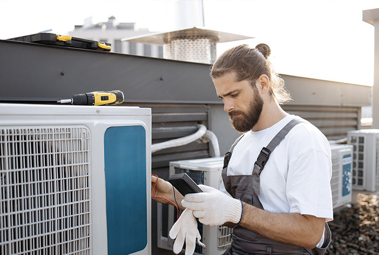 Rick's Affordable Heating & Cooling technician performing air conditioning repair in Perrysburg, OH