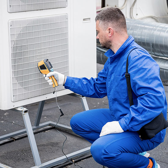 Rick's Affordable Heating & Cooling technician beginning heat pump repair in Perrysburg, OH