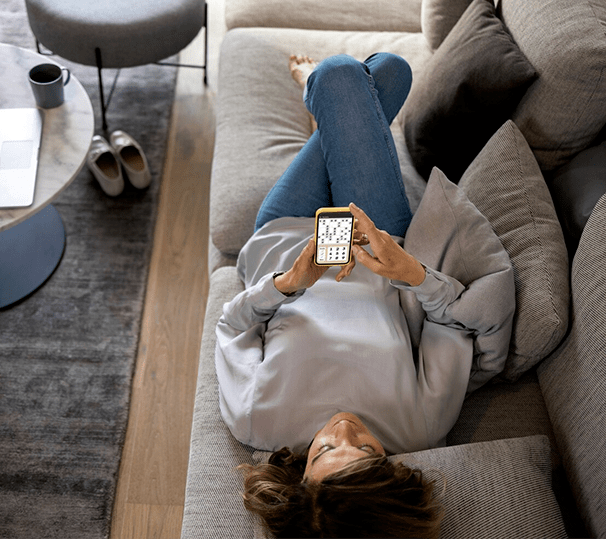 Woman lounges on couch after heating service in Perrysburg, OH