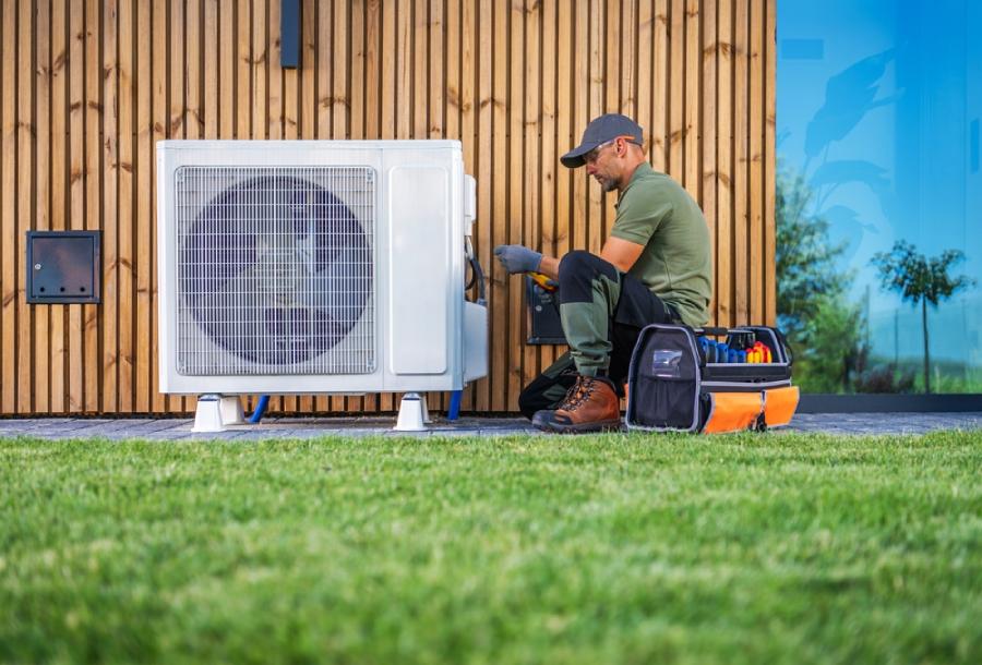 A technician working on an air conditioner.