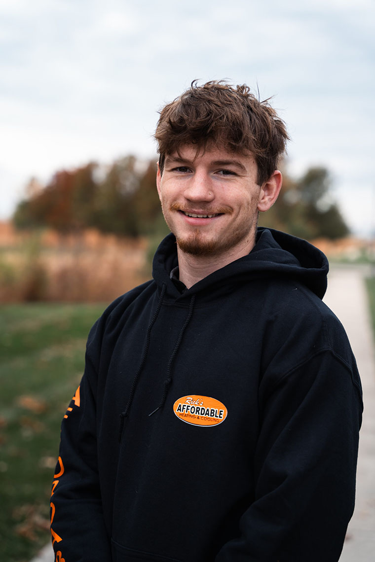 HVAC technician from Rick's Affordable Heating and Cooling in Sylvania, OH smiling for photo