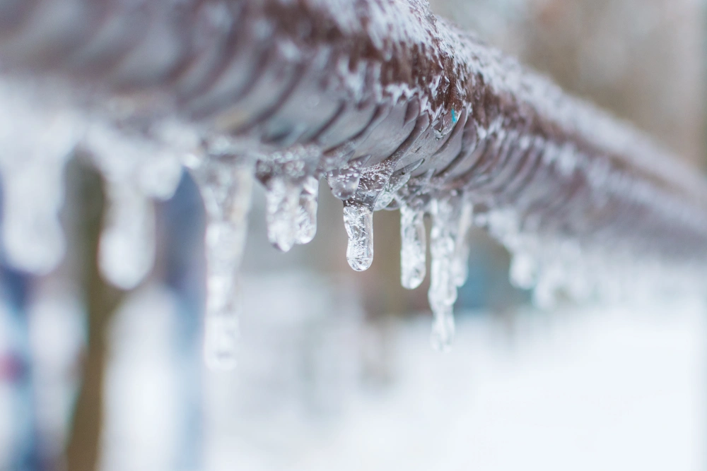 Icicles on a frozen pipe.